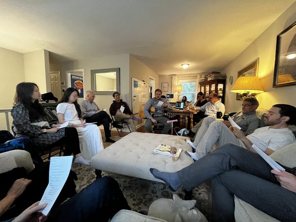 A small group seated together for Bible study with Scripture in hand